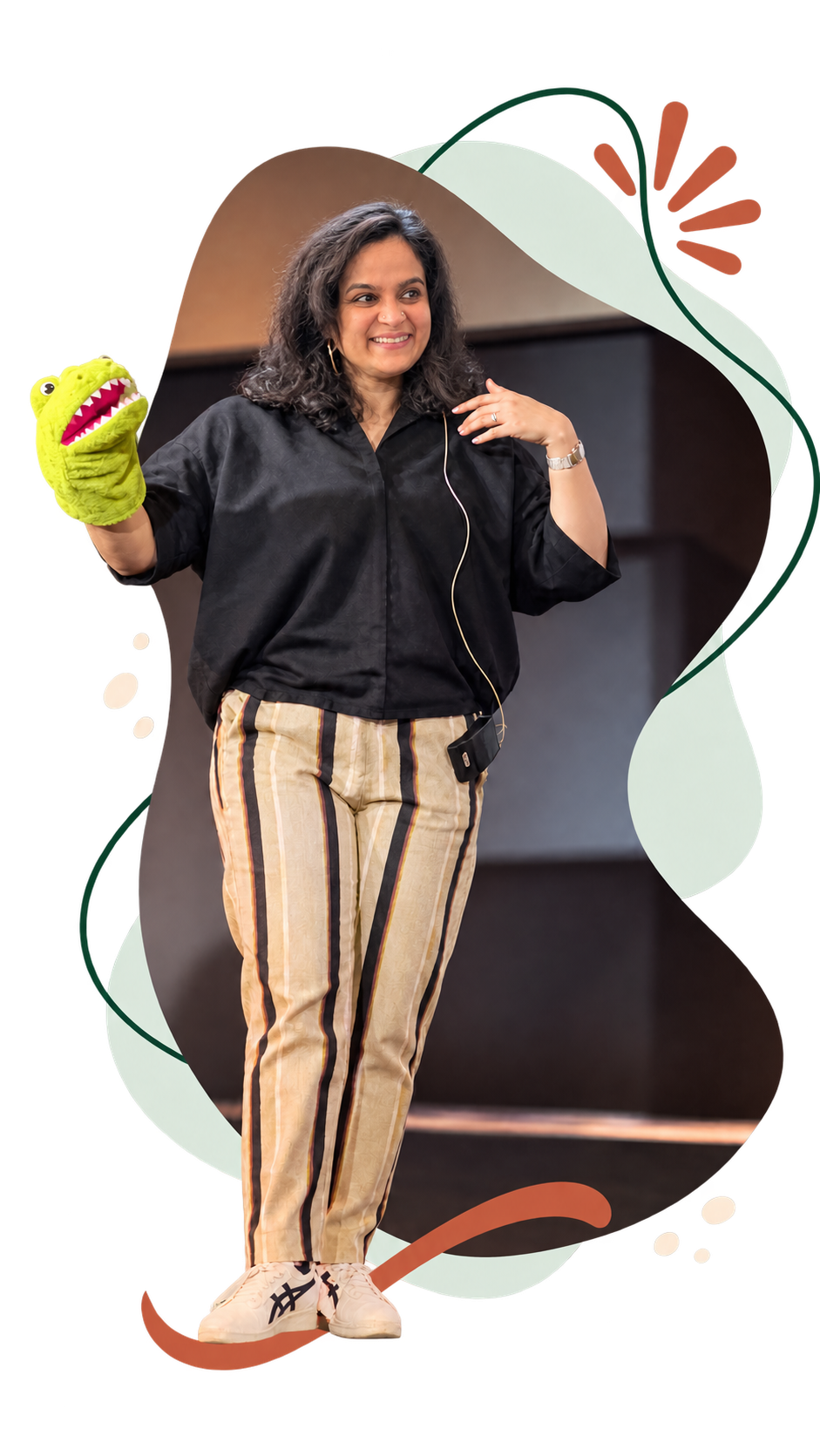 Rohini Vij demonstrating expressive storytelling with a green crocodile puppet