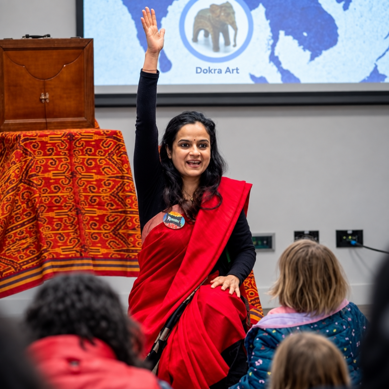Rohini’s storytelling gesture in a red sari Melbourne based storyteller Rohini Vij telling stories at commuity events