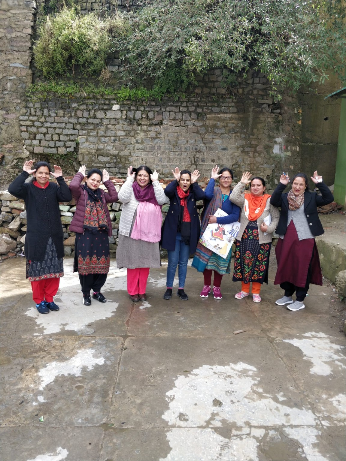 Rohini Vij and workshop participants practising expressive gestures during a storytelling workshop outdoors