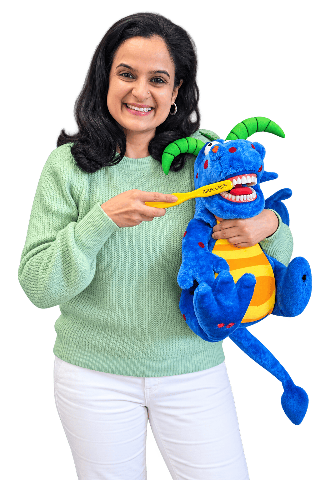 rohini vij melbourne based storyteller holding a puppet and demonstrating children how to brush using a story and song
